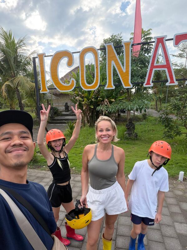 Batuh and guests at the ICON Bali sign